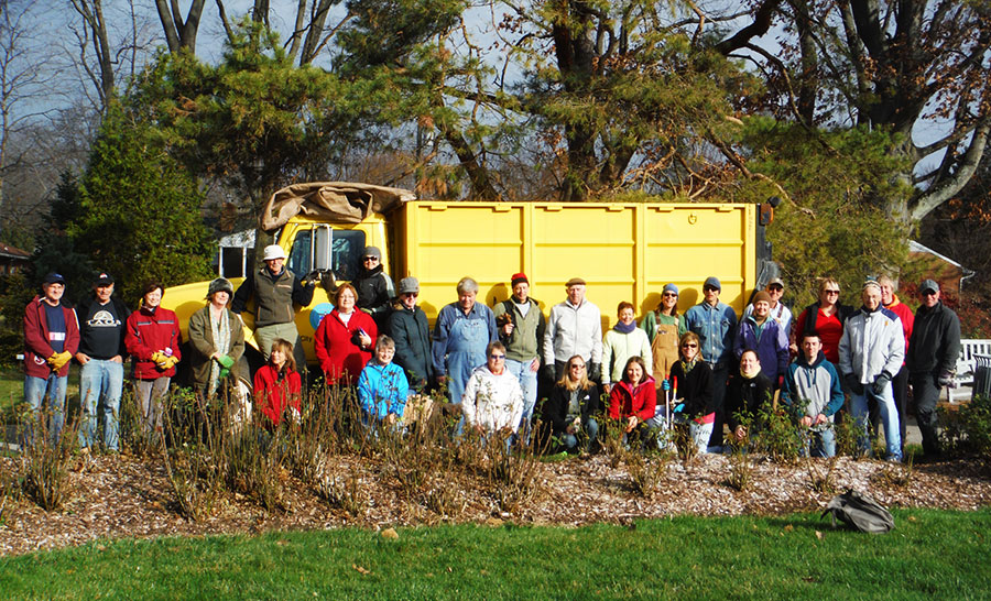 group photo of volunteers near truck